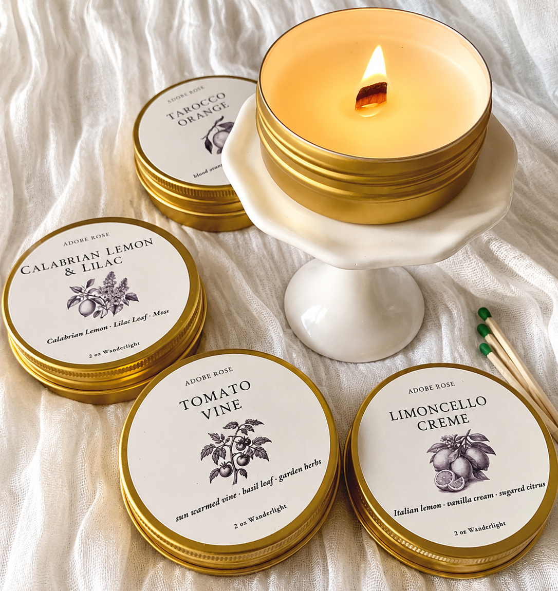 Candle with decorative lids on a textured surface