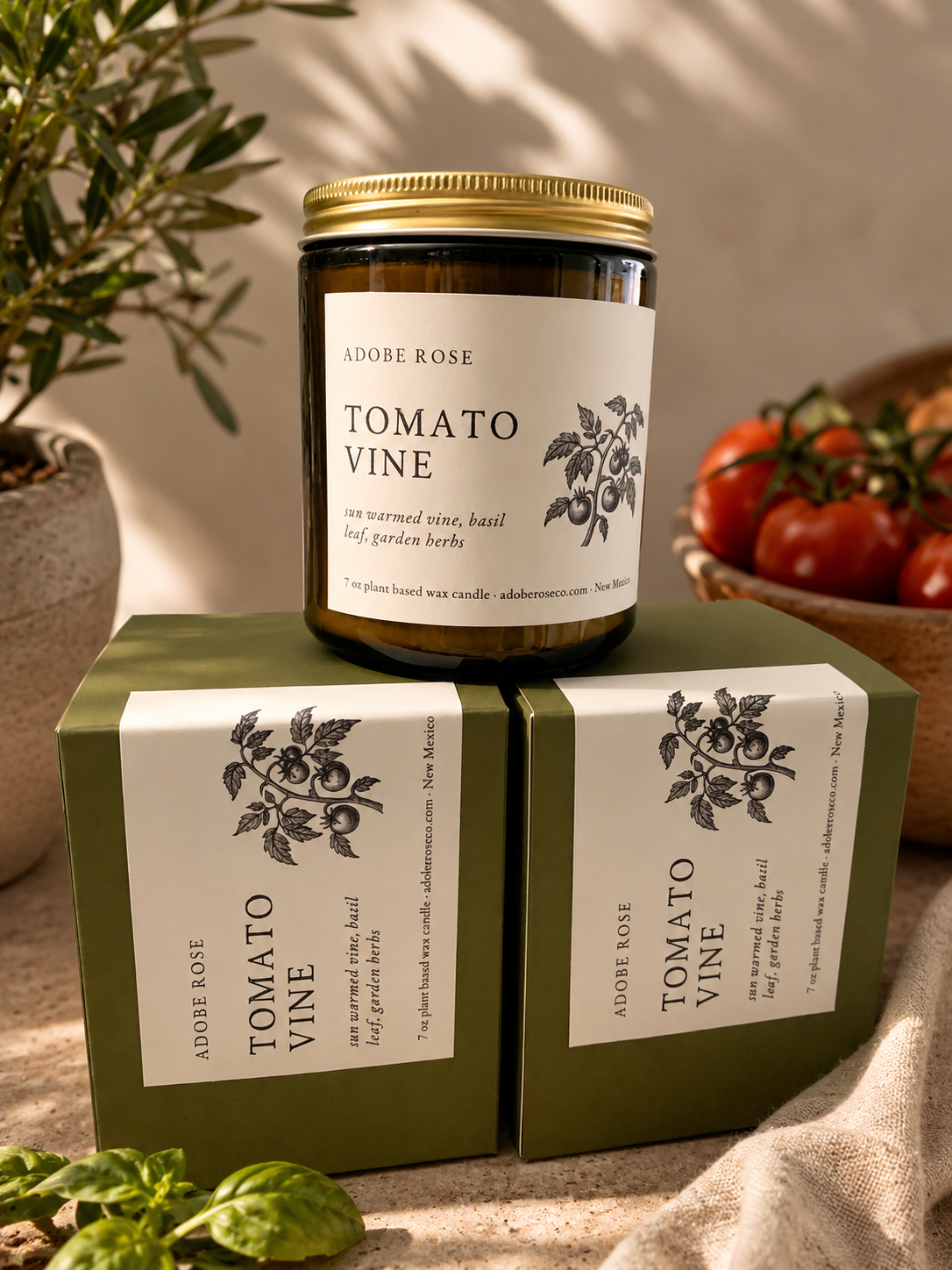 Jar of 'Tomato Vine' candle with matching packaging on a neutral background
