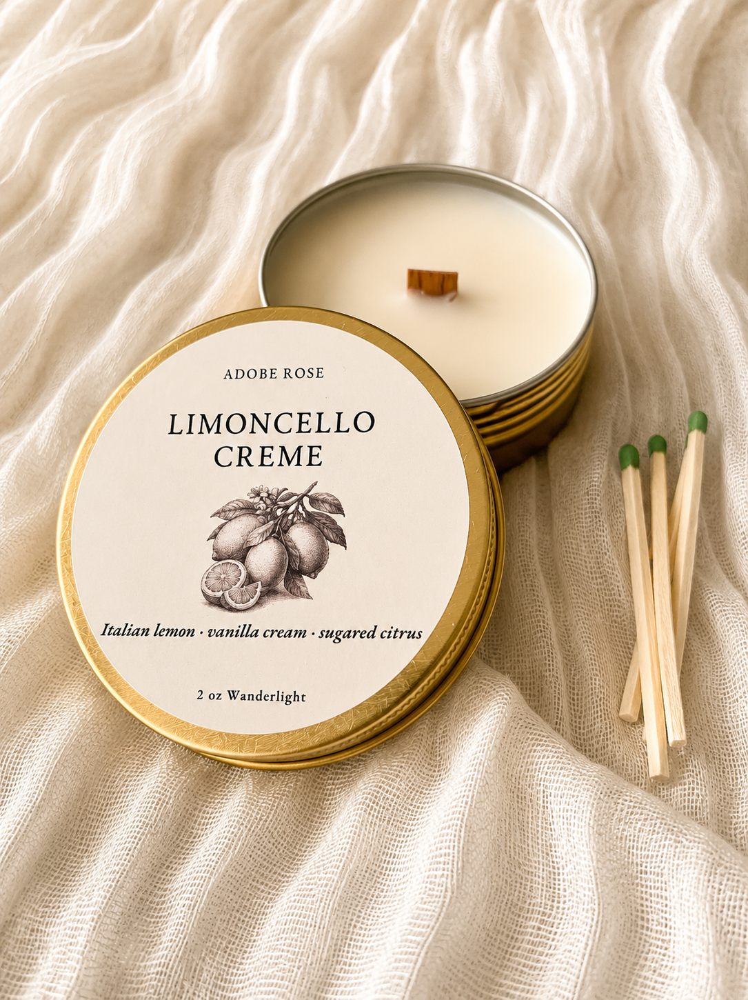 Candle with 'Limoncello Cèreme' label on a textured fabric background